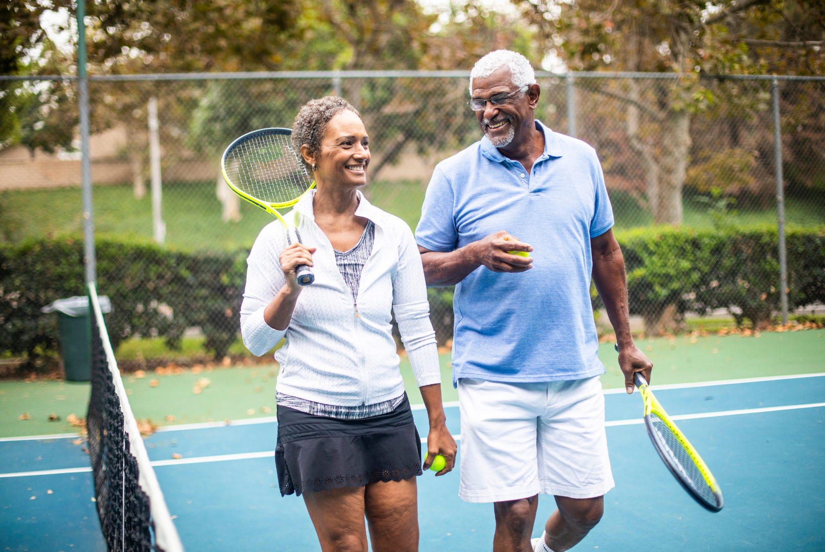A man and woman playing tennis